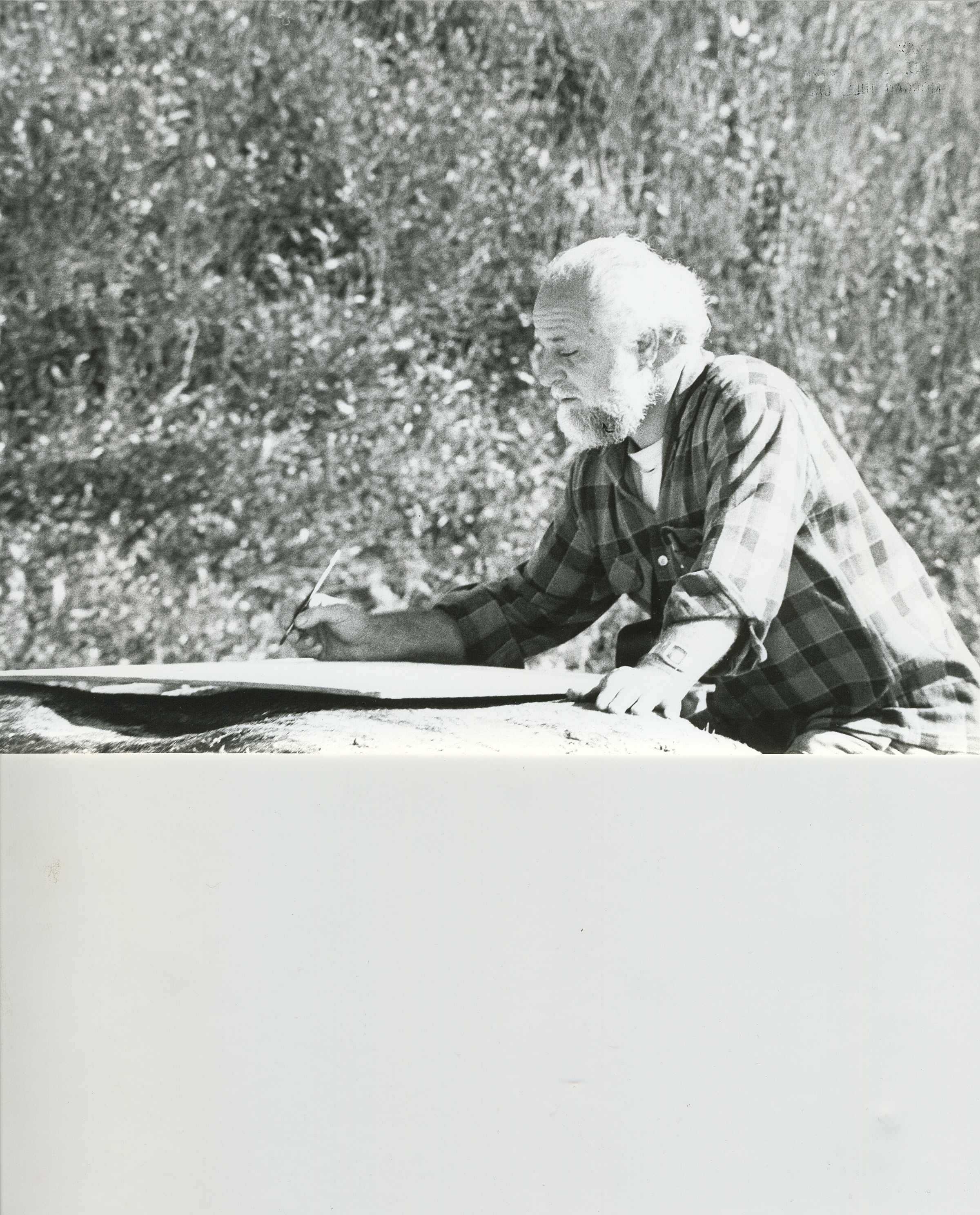 An older Freimark paints outside