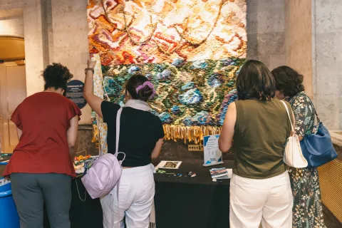 Individuals participate in an activity at a MCAAD event.